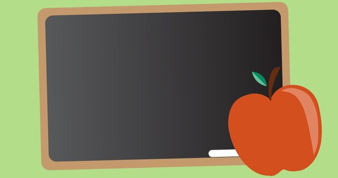 Illustrative image of apple with writing slate and chalk against green background, copy space