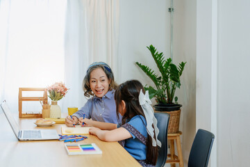 Asian portrait, grandchild granddaughter grandma grandmother and granddaughter happily join in activities to enhance skills for grandchildren