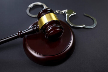 judge's gavel and handcuffs on