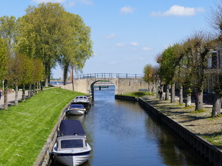 Fototapeta premium Canal through (Dutch) Sloten (Frisian) Sleat, Friesland, Netherlands