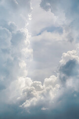 blue sky with white fluffy cumulus clouds close up