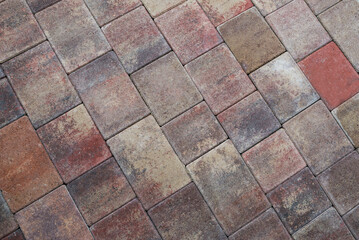 Texture of colored cobblestones for backgrounds. Concrete pavement on the sidewalk