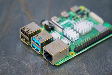 Raspberry Pi 4 B circuit board on a grey slate background