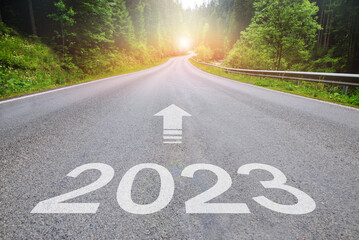 2023, concept photo of asphalt road. 2023 Year Calendar cover with summer forest and road....