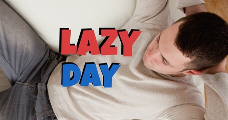 Digital composite image of caucasian man resting at home with lazy day text - Powered by Adobe