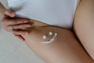 The body of a girl in white underwear. High quality photo