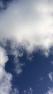white clouds on blue sky vertical

