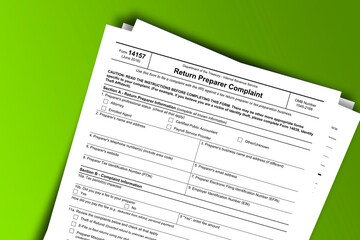 Obraz premium Form 14157 documentation published IRS USA 11.27.2018. American tax document on colored