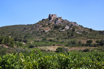 Ruins of the medieval Aguilar Castle on top of a mountain near Tuchan, Occitanie region in France