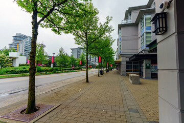 Shopping strip at UniverCity on Burnaby Mountain,  BC, early on an overcast Spring morning.