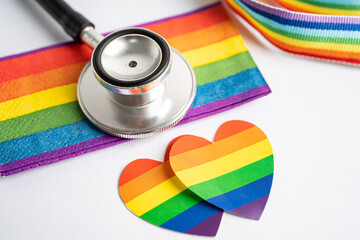 Black stethoscope with rainbow flag heart on white background, symbol of LGBT pride month celebrate annual in June social, symbol of gay, lesbian, bisexual, transgender, human rights and peace.