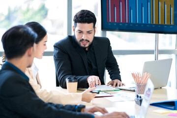 Bearded Asian businessman doing business at company office