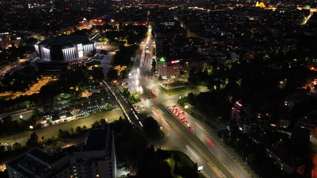 Night shot of the National Palace of Culture (NDK) taken with a drone - timelapse and spinning around the crossroads.