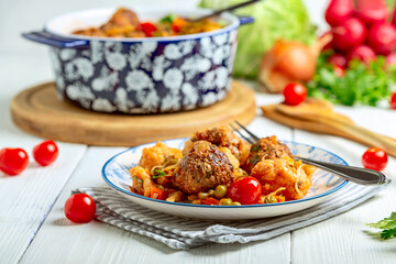 Meat meatballs with stewed vegetables.