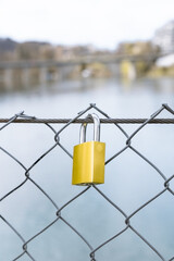 Padlock on the river bridge