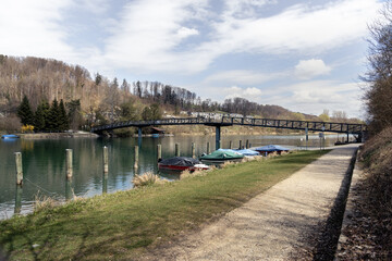 Obraz premium River landscape with boats and bridge