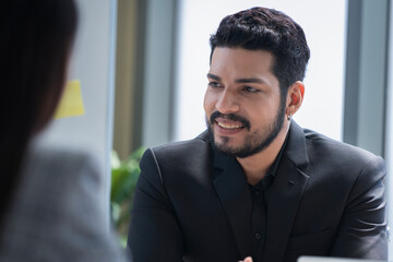 Naklejka premium Bearded Asian businessman doing business at company office