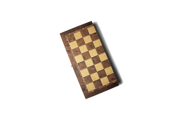 Closed box with chess on a white background. Top view, flat lay