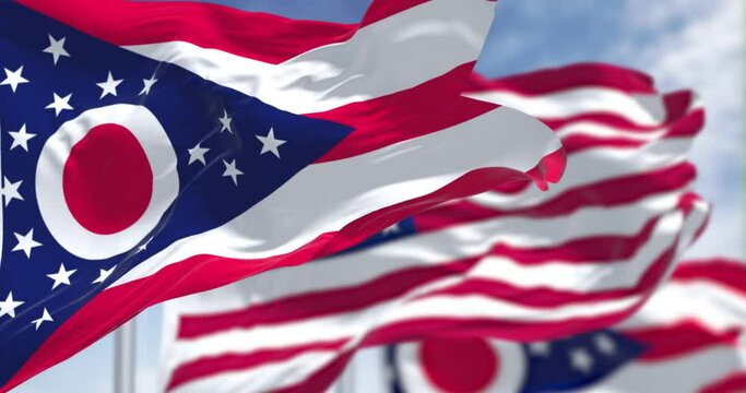The Ohio state flag waving along with the national flag of the US