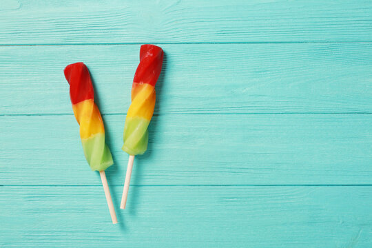 Two Popsicles On Blue Background With Copy Space