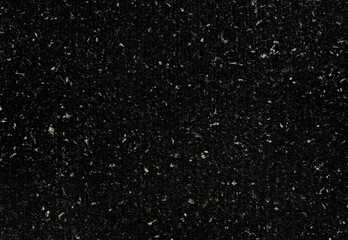 dark black real terrazzo cement wall with shallow groove pattern. close up view of black concrete...