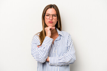 Young caucasian pregnant woman isolated on white background suspicious, uncertain, examining you.