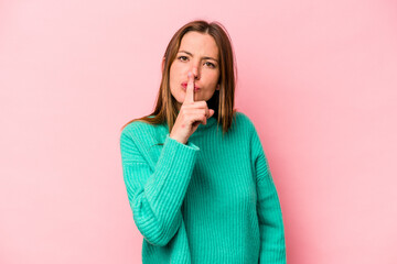 Young caucasian pregnant woman isolated on white background keeping a secret or asking for silence.