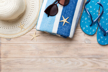 Summer vacation concept flat lay. straw hat beach accessories and towel top view. Space for text. travel concept