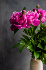 Summer interior decor with peony blooming
