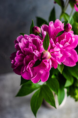 Summer interior decor with peony blooming