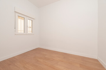 Empty room with aluminum window, oak floor and plain white painted walls