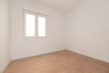 Empty room with white aluminum window, street view, plain white painted walls, light wooden floor