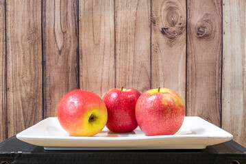 White tray with ripe pink lady apples ready to eat