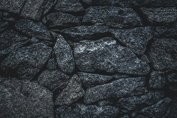Dark brick. Grunge Rough structure. Silver Wall. Rock background. Rock texture. Black texture. Stone background. Rock pile. Paint spots. Rock surface with cracks. Abstract texture.