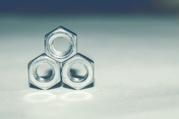 Metal figure of nuts. Balance nuts. Round nuts for work