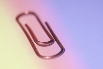 Paper clip on a white background. Design tool. Stationery tool