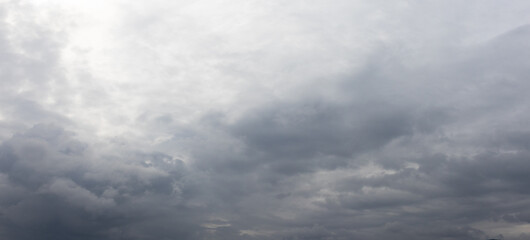 Dramatic grey cumulonimbus cloud before rain. Low storm clouds in the sky.
