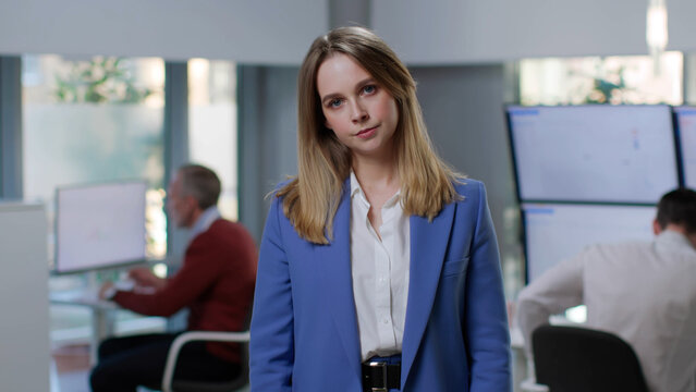 Anxious young specialist looking at monitor or board and thinking