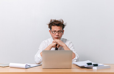 Asian business man sitting and working and stressed