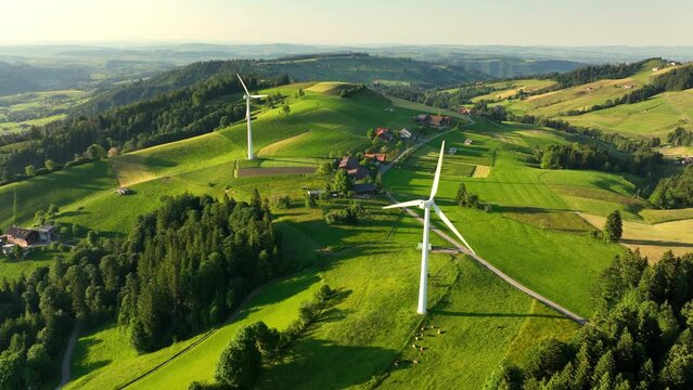 wind farm on green rolling hills in rural area in Europe, renewable energy and sustainable development concept, wind turbines in green meadows, alternative energy, natural electricity 