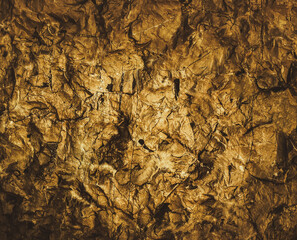 Rock pile. Gold texture. Golden Ore rocks. Stone background. Abstract texture. Stone texture. Structure. Shimmering surface. Precious Foil. Rough structure mineral. Rock texture.
