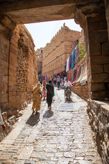 Tourists walk in Jaisalmer fort in Rajasthan, India.