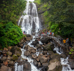 AMBOLI, September 2021: Tourists enjoy rain day at Amboli water falls on Maharashtra-Goa boarder, India.