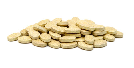 Brown pills, medicine isolated on white background, top view