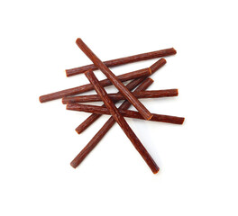 Smoked stick sausages, isolated on white