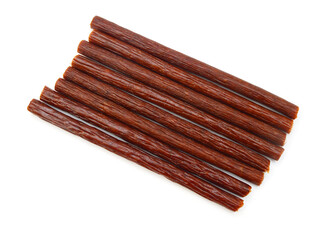 Smoked stick sausages, isolated on white