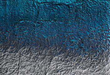 Rock texture. Dark stone wall. Stone background. Rock surface with holography, nacre. Stone texture...