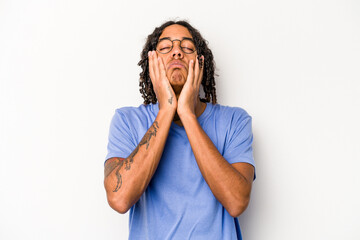 Young African American man isolated on white background whining and crying disconsolately.