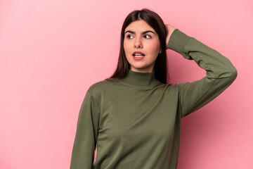 Fototapeta premium Young caucasian woman isolated on pink background being shocked, she has remembered important meeting.