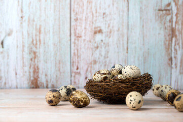 Fresh quail eggs. Rustic style on wood background. Easter banner with place for text